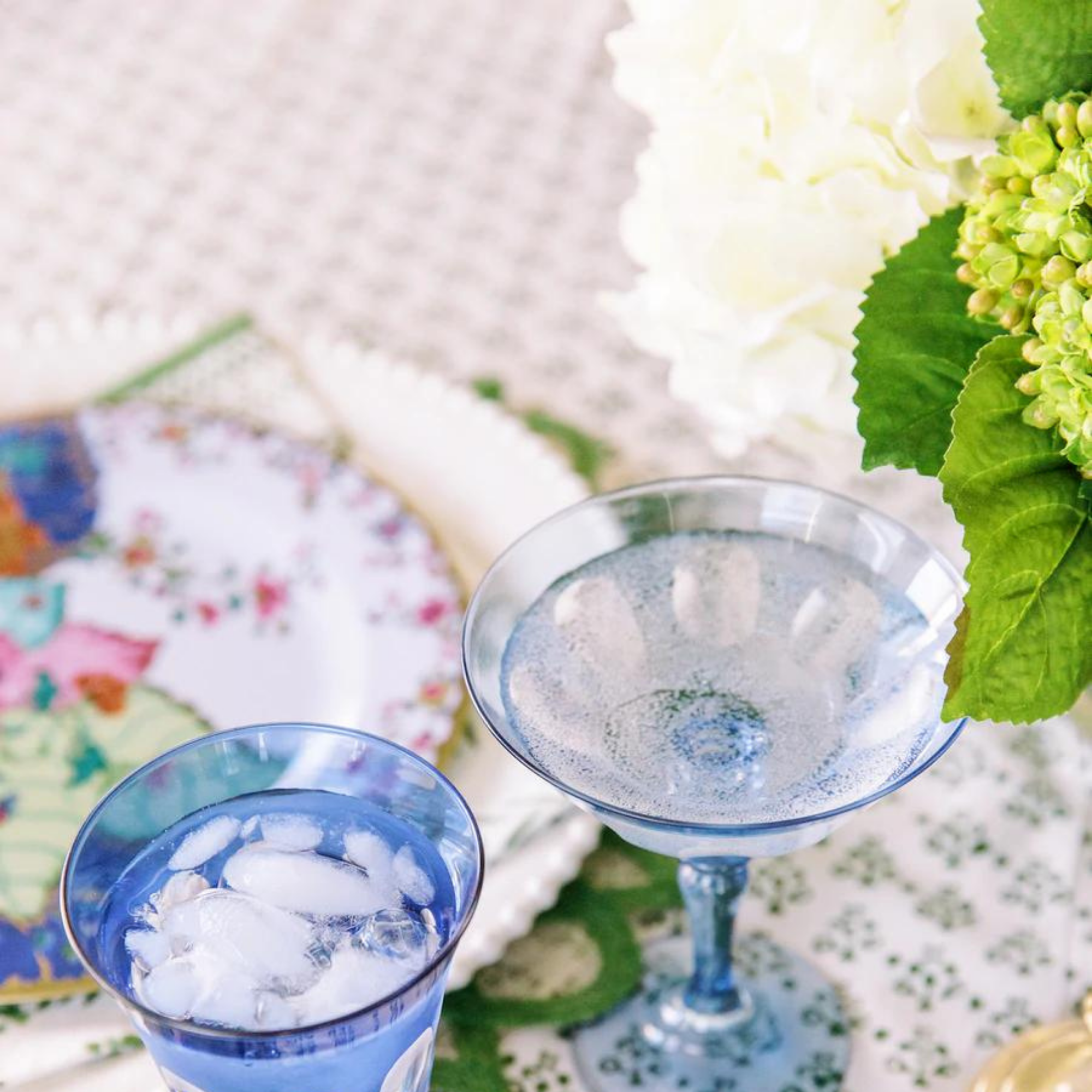Green and White Hydrangea Bouquet in Glass Vase